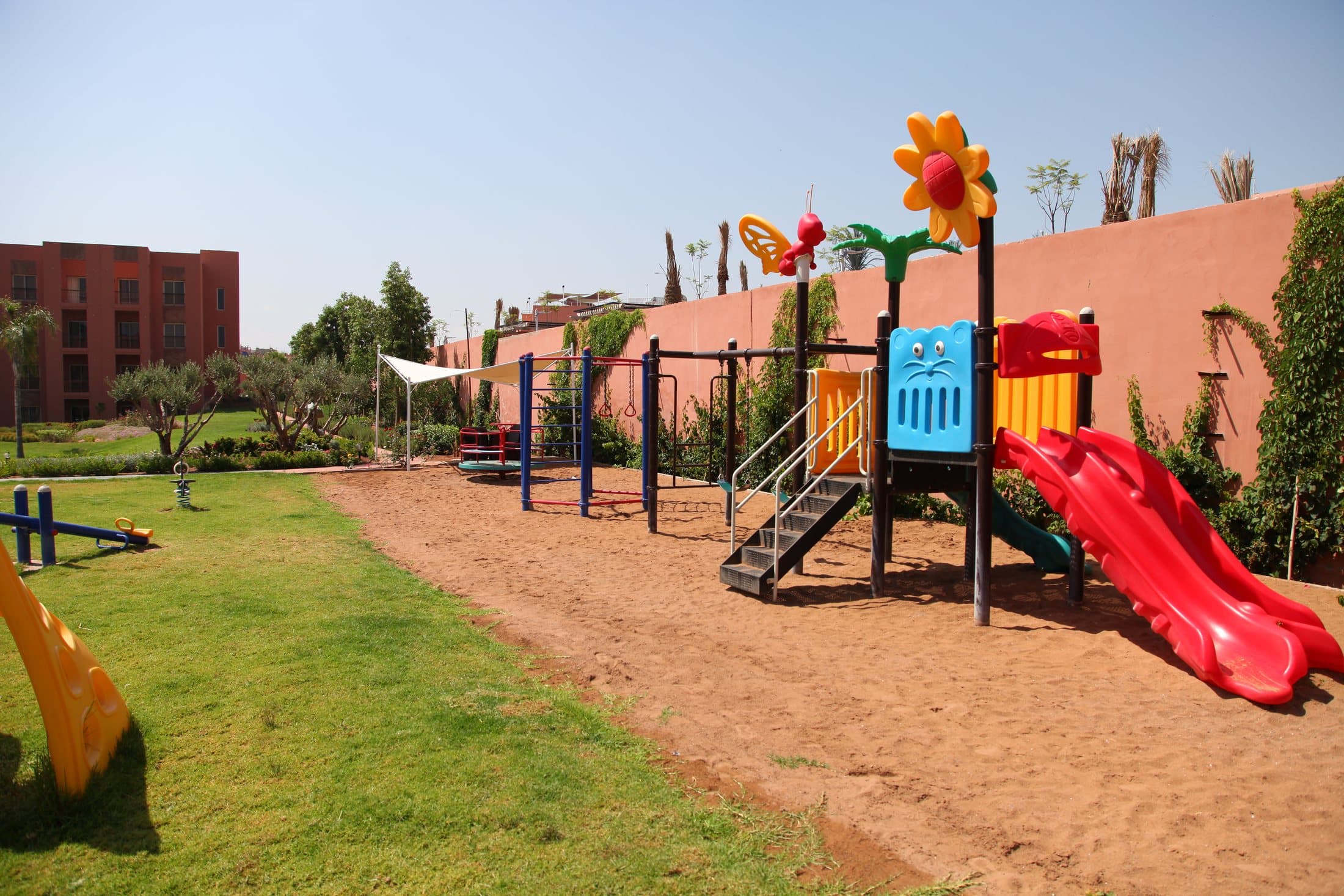 The colourful children's playground in the gardens